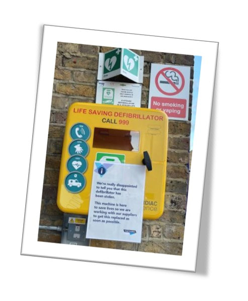 Picture of Stolen Defibrillator and No Smoking Sign